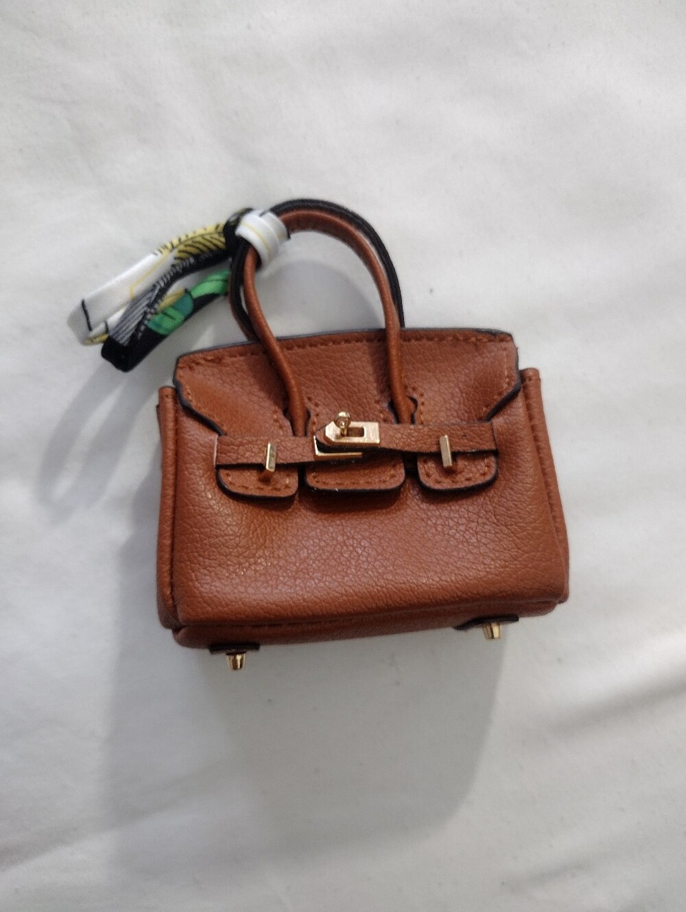 Luxury Brown Leather Top-Handle Mini Bag with Scarf Accent Charm